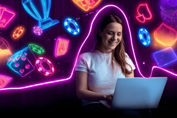 একটি উৎসবমুখর অনুষ্ঠানে স্মার্টফোন ব্যবহার করছেন একজন খেলোয়াড়—যা 4777BIT–এর সম্পূর্ণ মোবাইল-ফ্রেন্ডলি অভিজ্ঞতাকে তুলে ধরে।